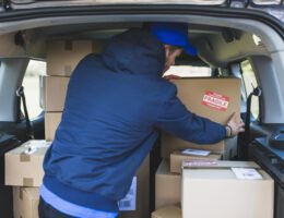 deliveryman-car-with-carton-boxes_23-2147767539-aed5010e
